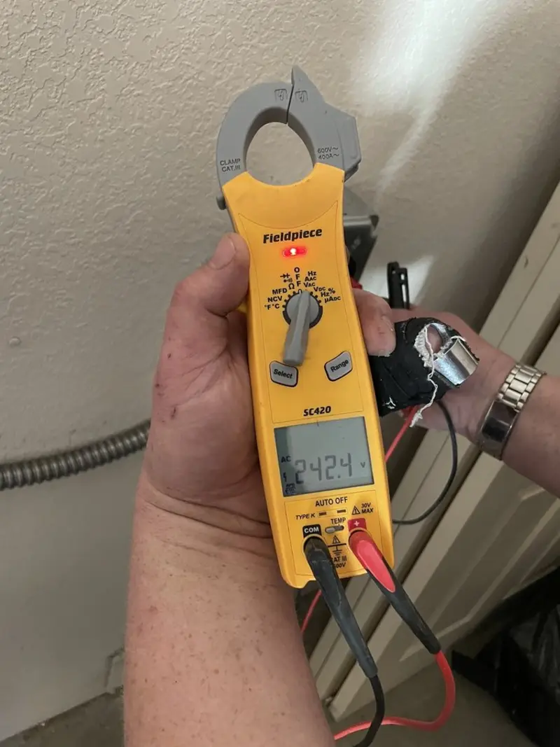 Voltage testing with clamp meter during Electrical Installation Services in Rincon